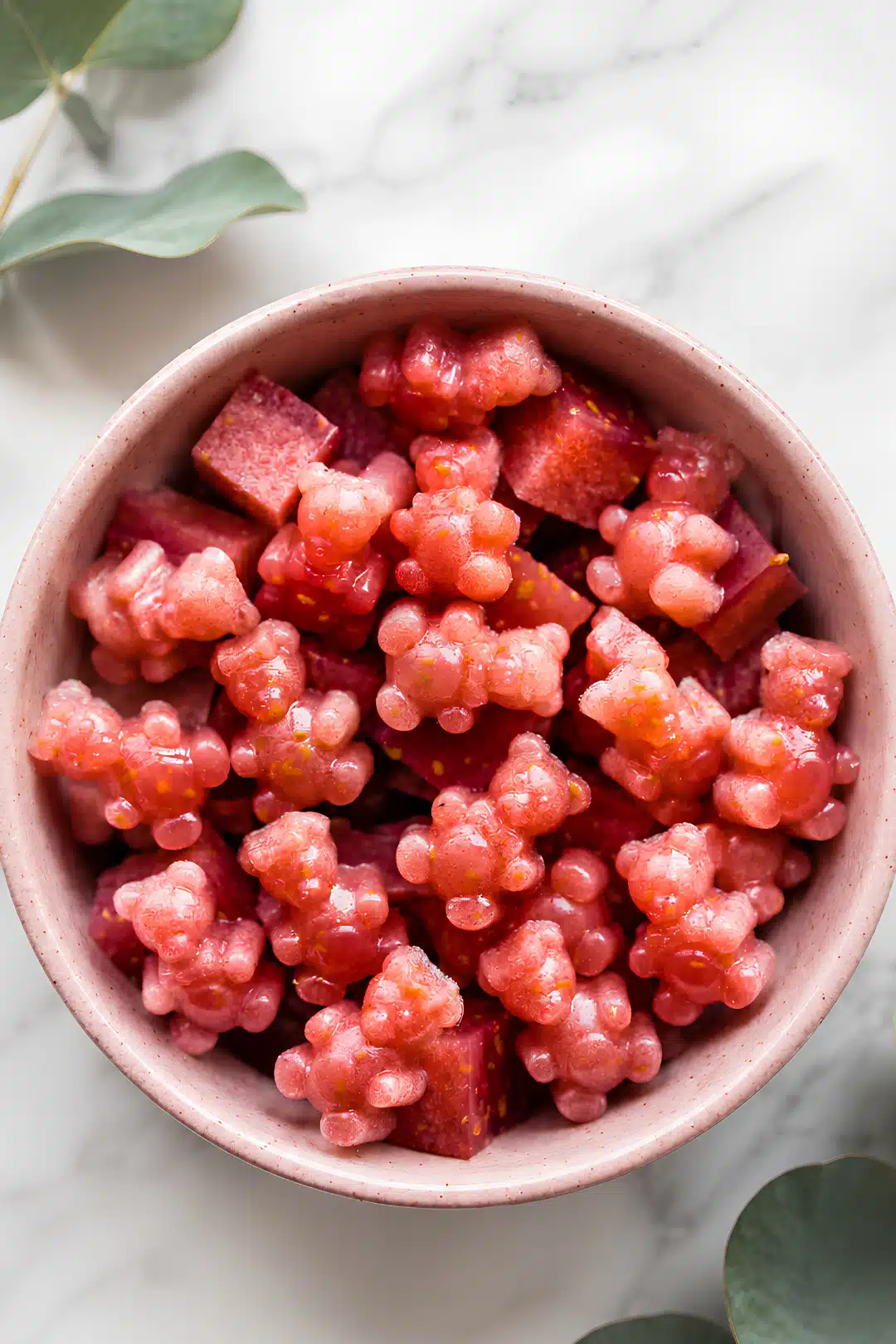 Strawberry gummy bears in pink bowl